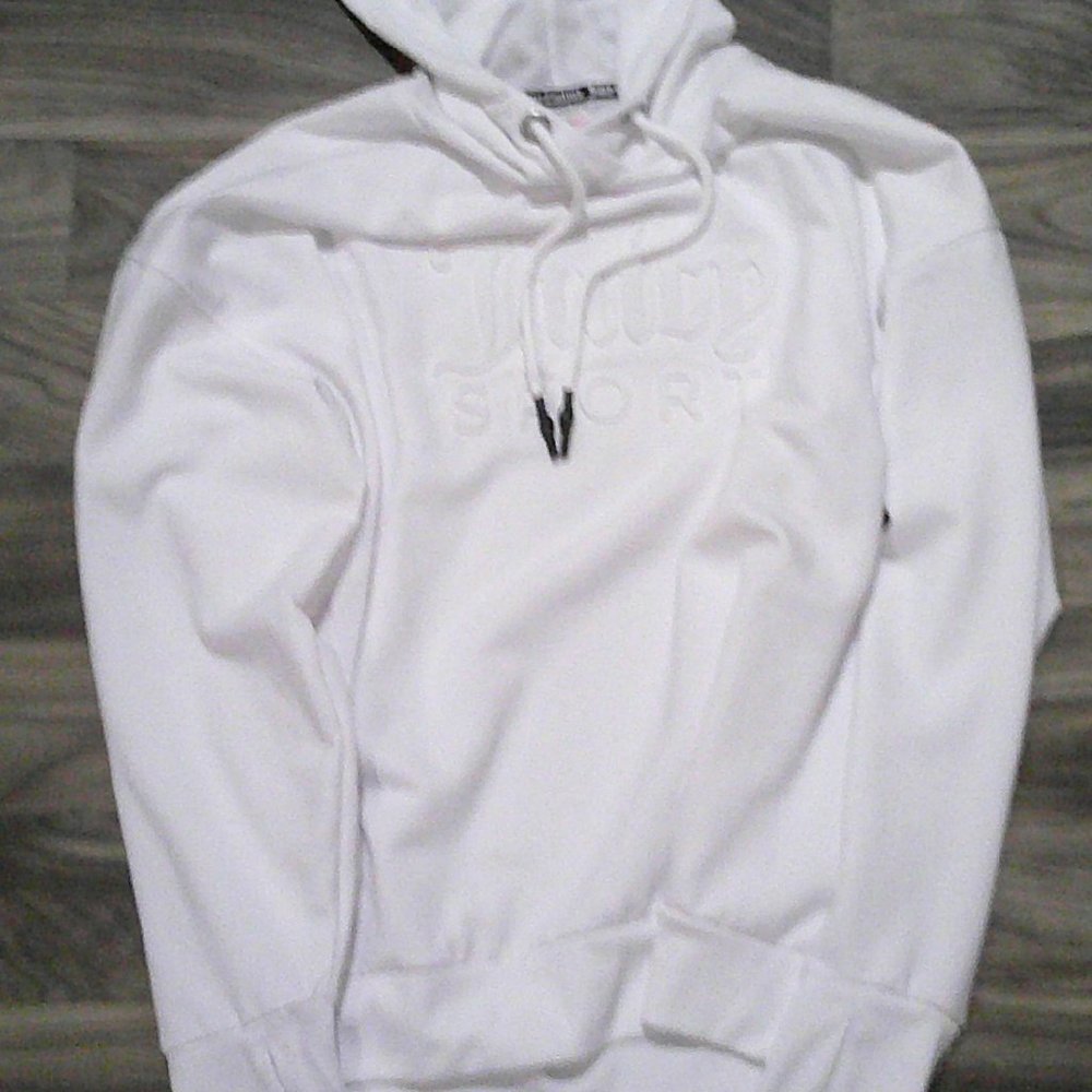 White Juicy Couture Pullover Hoodie with drawstring and kangaroo pockets.